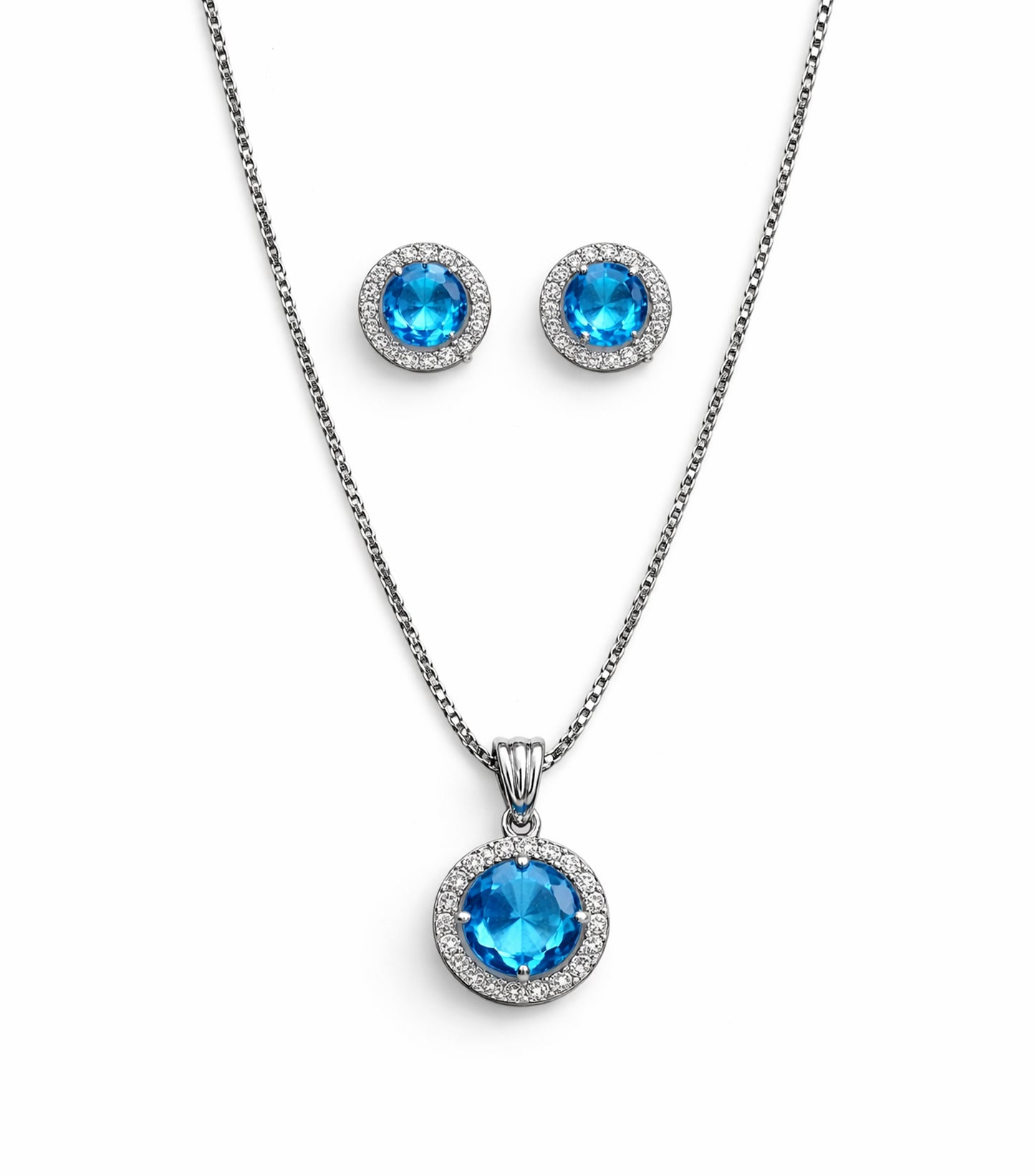 Jewelry set with blue gemstone pendant and earrings on a white background