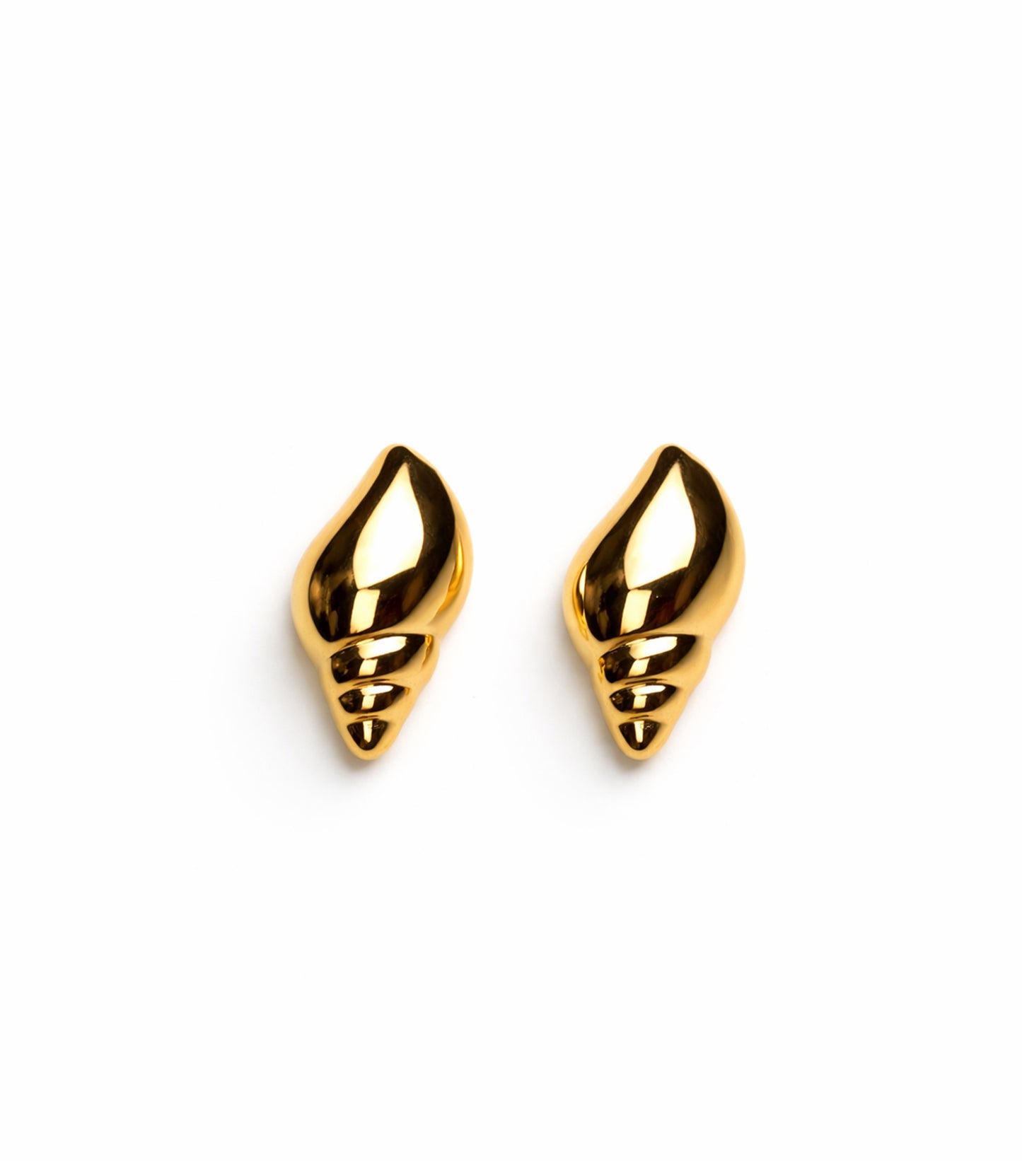 Pair of gold shell-shaped earrings on a white background