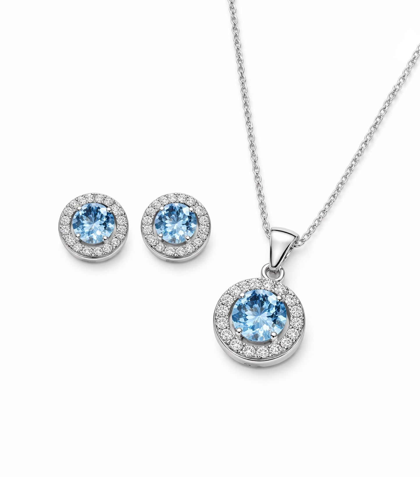 Jewelry set with round blue gemstones on a white background