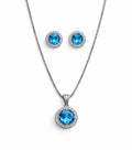 Jewelry set with blue gemstone pendant and earrings on a white background