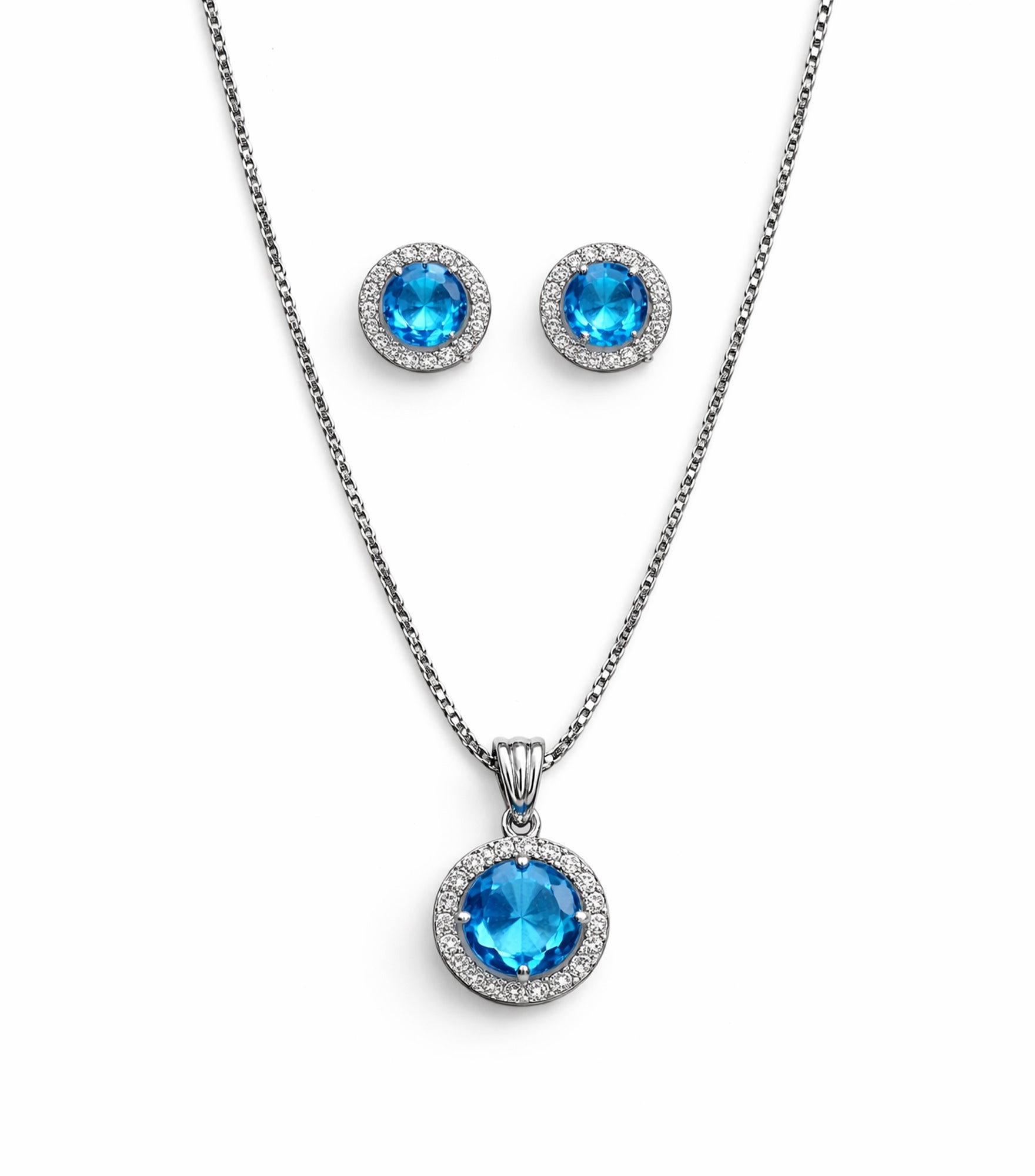 Jewelry set with blue gemstone pendant and earrings on a white background