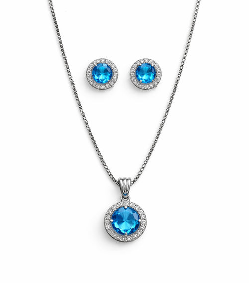Jewelry set with blue gemstone pendant and earrings on a white background