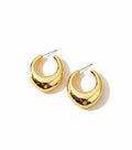 Gold hoop earrings on a white background