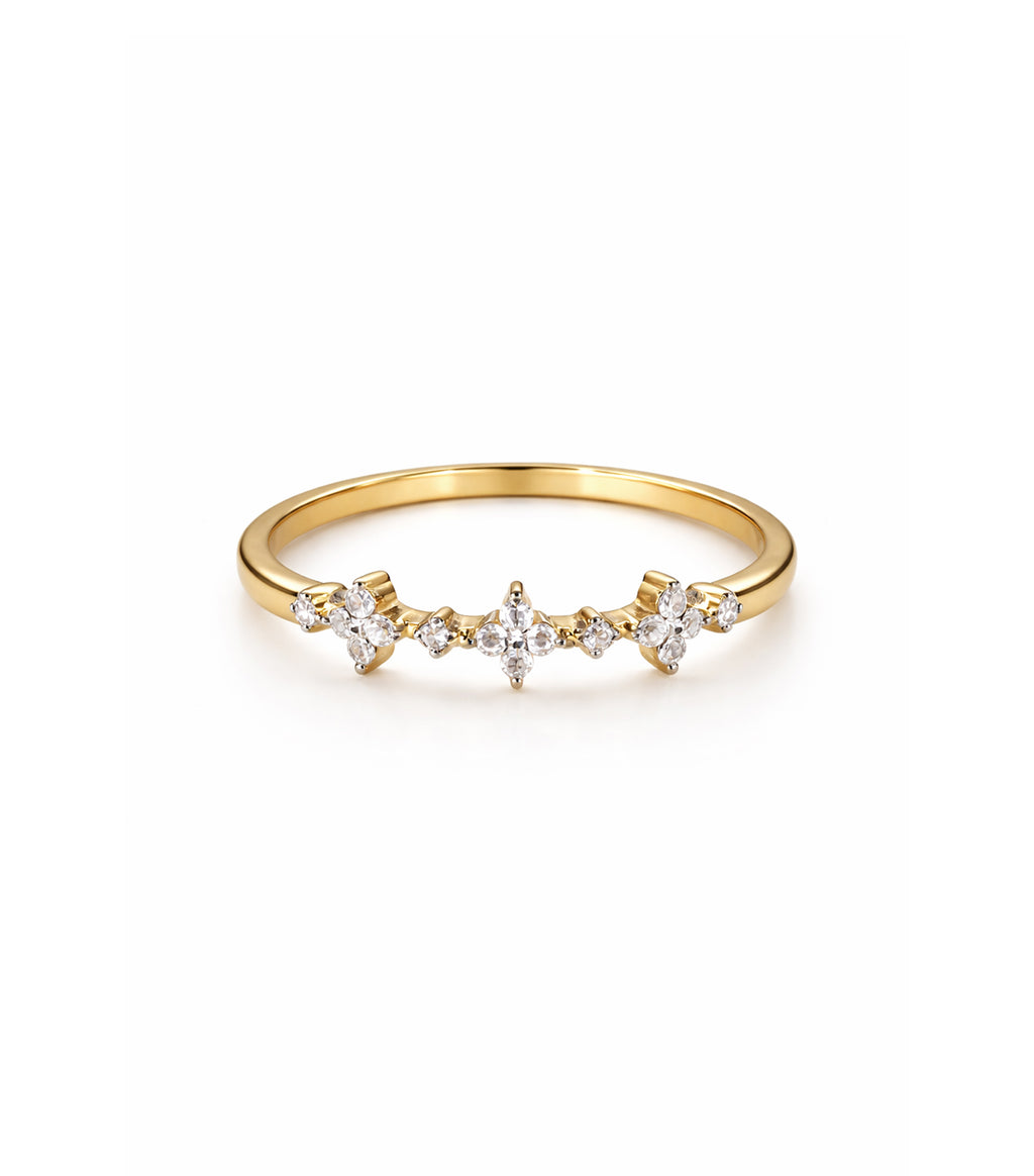 Gold ring with small diamonds on a white background