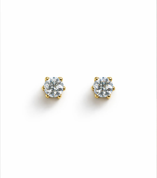 Pair of diamond stud earrings on a white background
