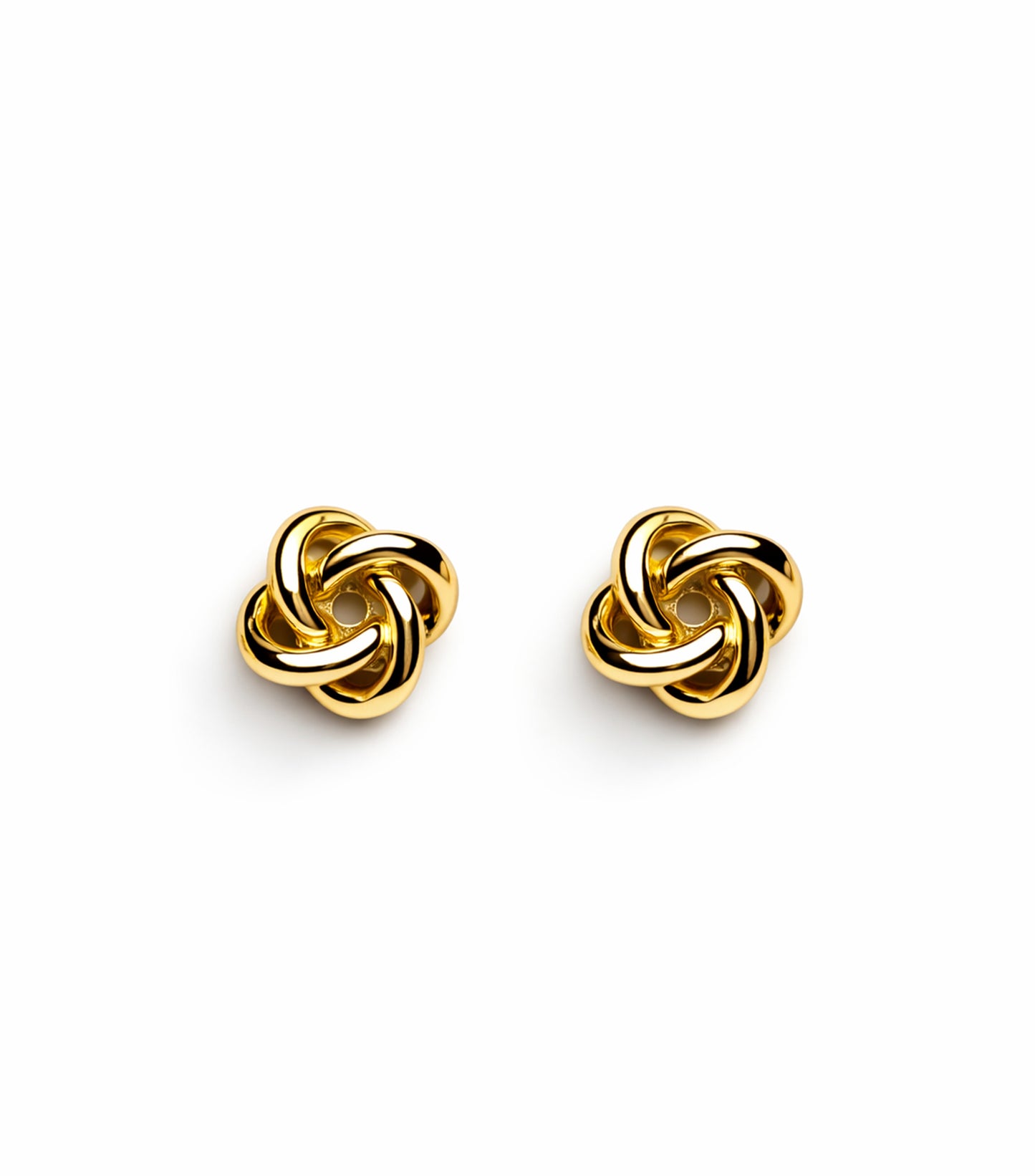 Pair of gold interwoven earrings on a white background