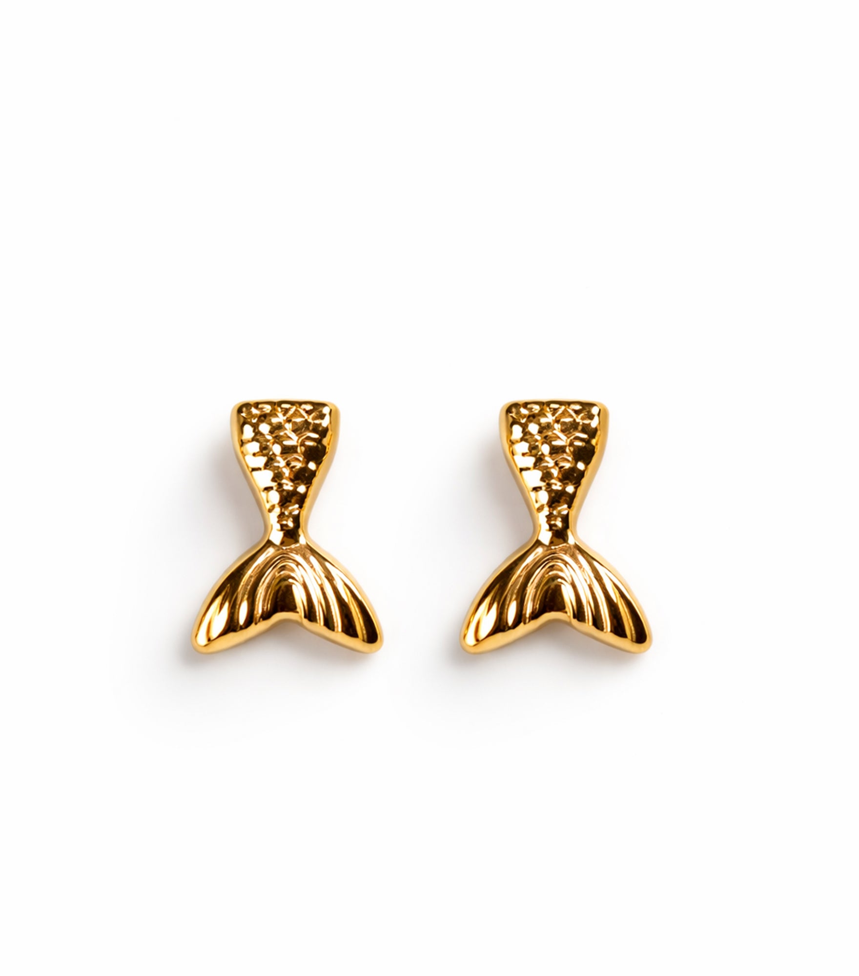 Gold mermaid tail earrings on a white background