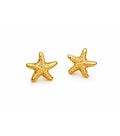 Gold starfish earrings on a white background