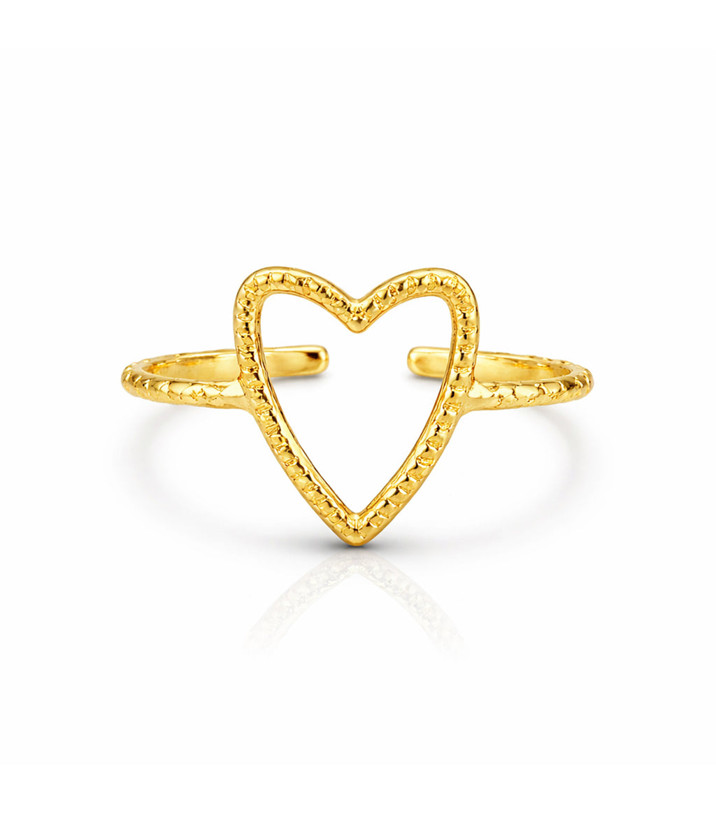 Gold heart-shaped ring on a white background
