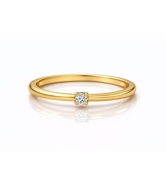 Gold ring with a small diamond on a white background

