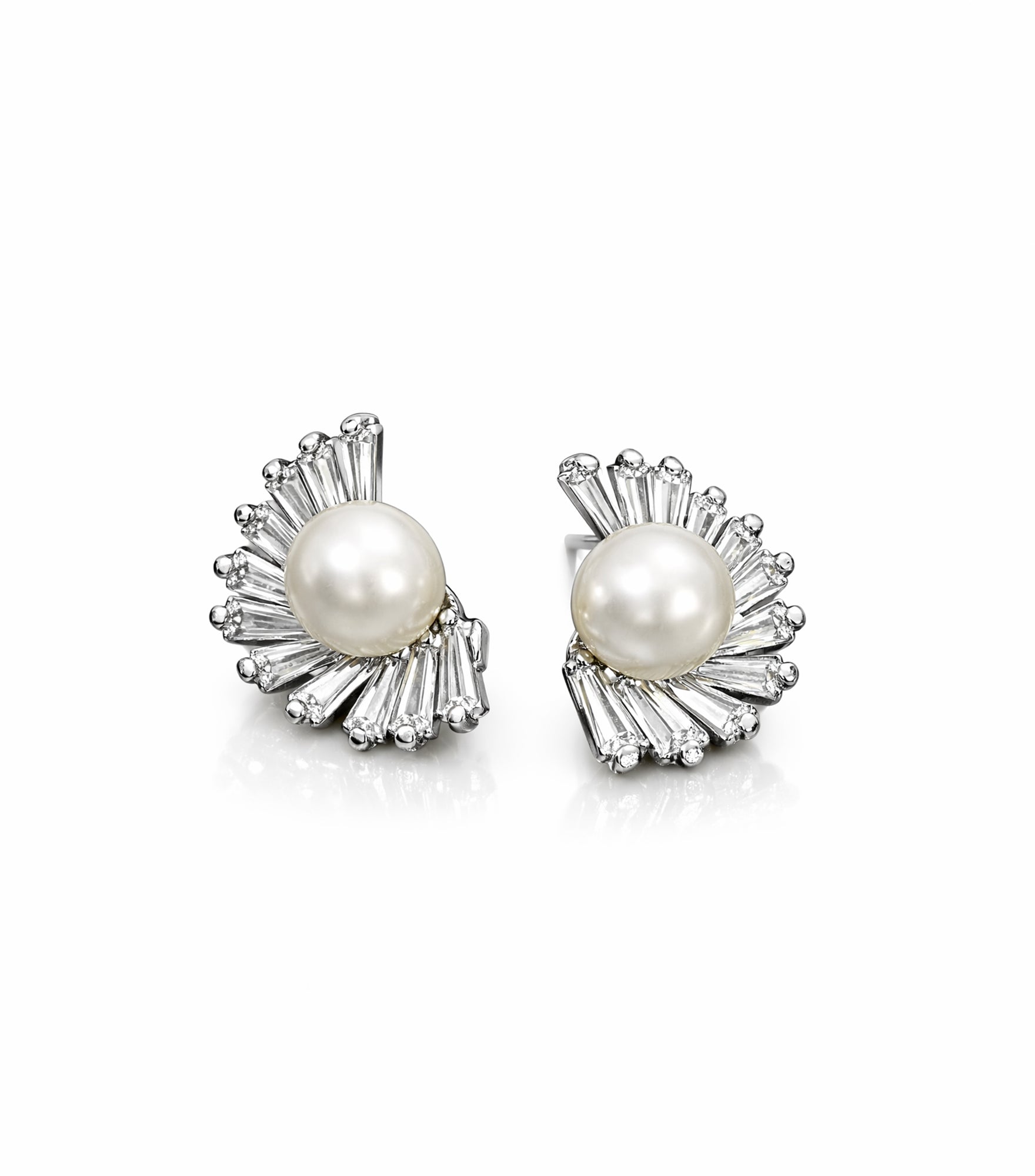 Pair of pearl earrings with silver accents on a white background