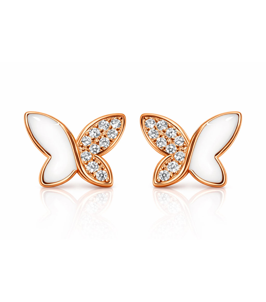 Butterfly-shaped earrings with rose gold frames and white centers on a white background
