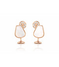 Pair of earrings with rose gold and white design on a white background